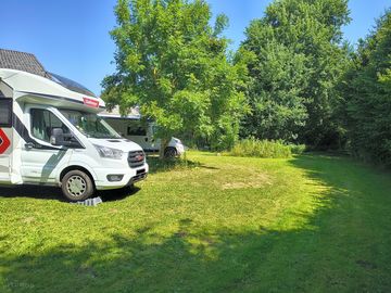 Partially shaded grass pitches